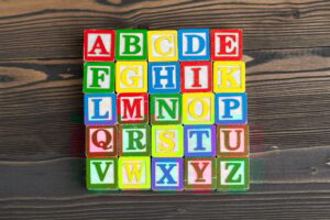 Alphabet blocks ABC on wooden table