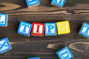 Alphabet blocks ABC on wooden table. Text- tips