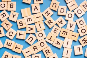 Background from wooden squares of Latin letters