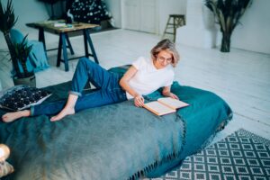Caucasian female in casual apparel spending time for literature hobby