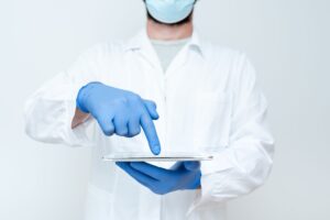 Doctor pointing at the tablet. Doctor explaining medical terms.
