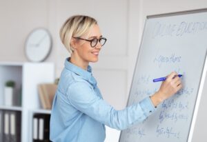 Experienced college lecturer teaching advanced mathematics online, writing down complicated problem