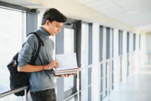 Happy indian male student at the university