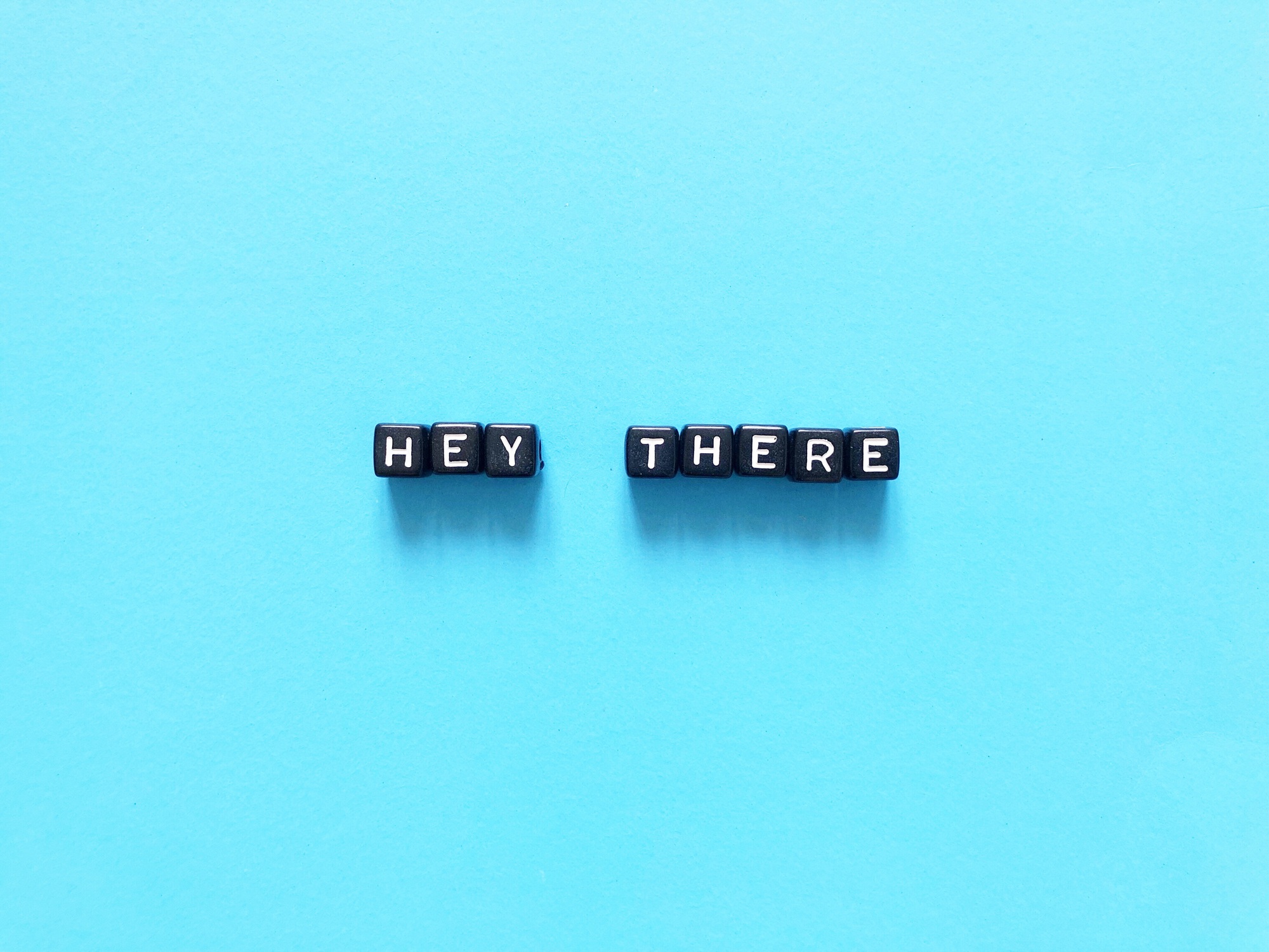 Hey there. Alphabet blocks. Hi. Hello. Word. Words. Letters and words.