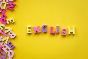 learn english language. text letters on yellow background.