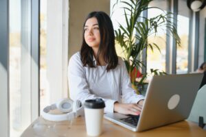 Smiling girl student study online with skype teacher