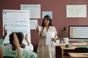 Teacher communicating with schoolkids