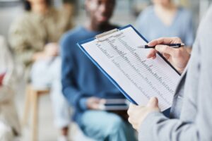 Teacher Holding Clipboard with English Grammar