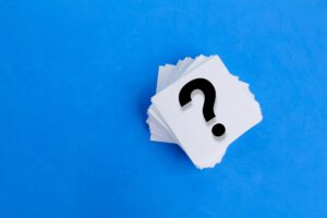 white paper with a question mark or question mark.