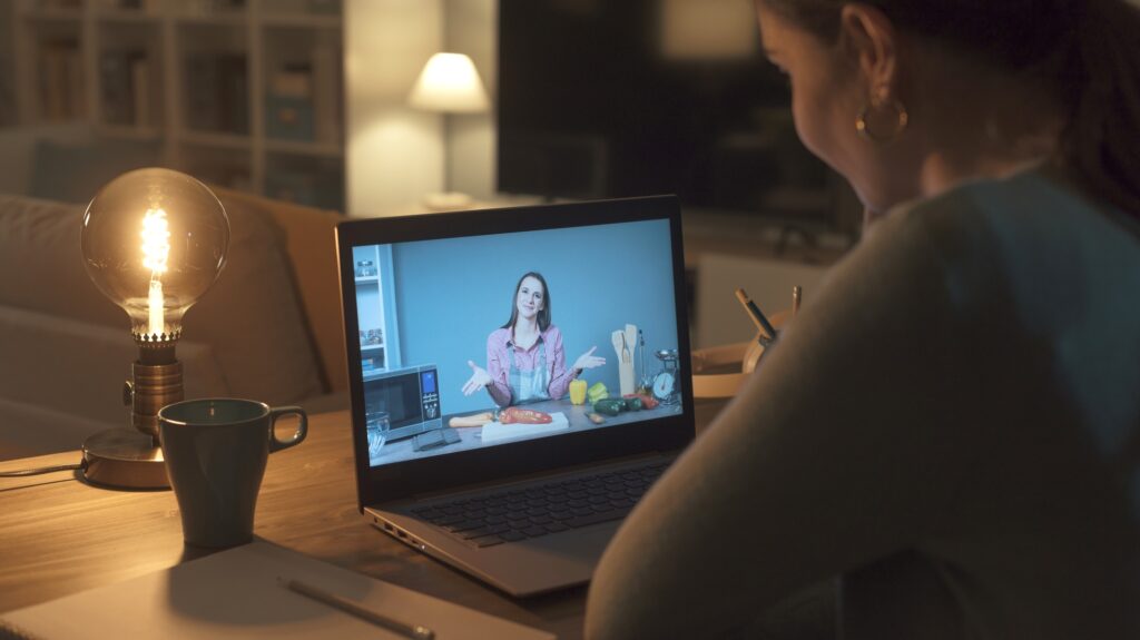 Woman learning recipes online