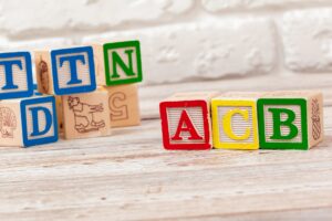 Wooden toy Blocks with the text: acb